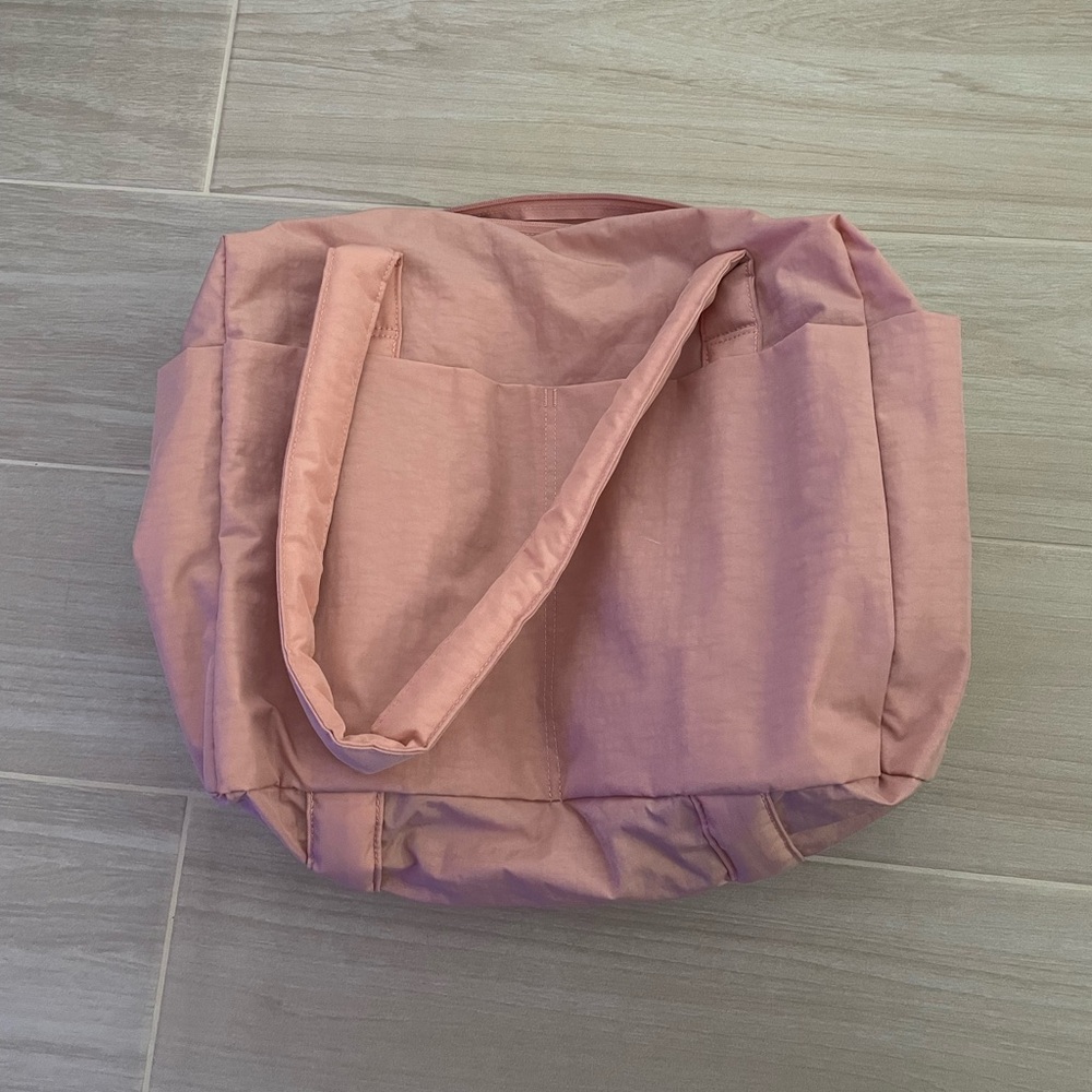 Baggu small cloud carry on in rose tan